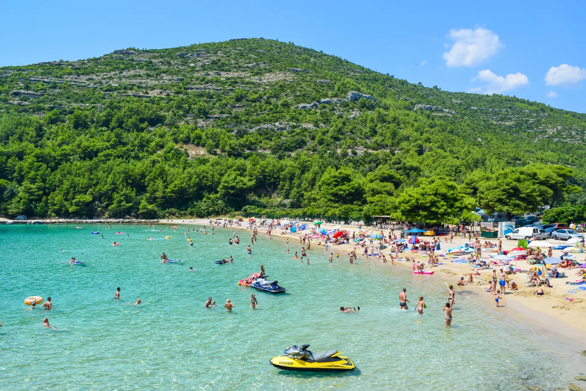 Prapratno, Croatia - July 26, 2018: July 26, 2018 Vacationers on the sandy beach at a summer sunny day.